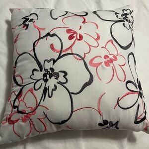 Pink and gray embroidered floral pillow on white throw pillow for couch bedroom